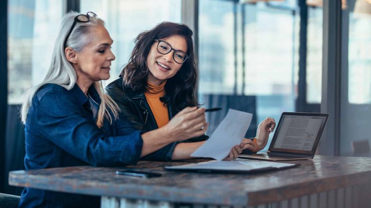 two women working together on as assignment